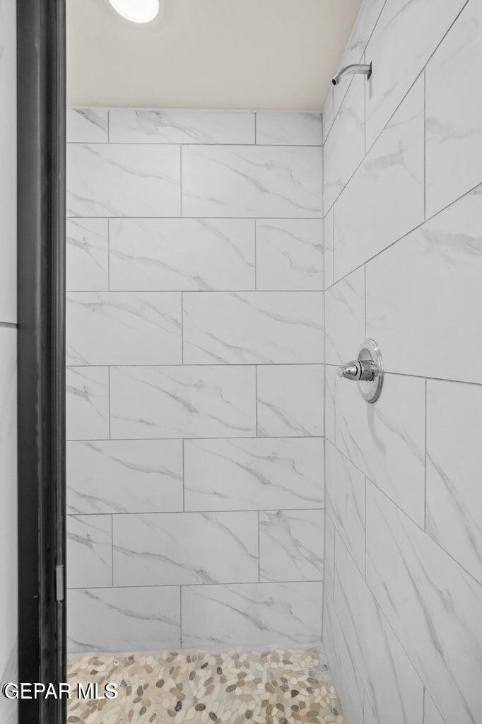 13090 Beccles Street El Paso, TX 79928 - Photo 9 of 23 a bathroom with a shower