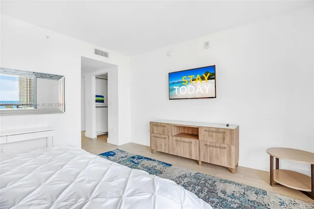 a bedroom with a bed and a cabinets