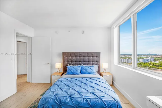 a bedroom with a bed and a couch