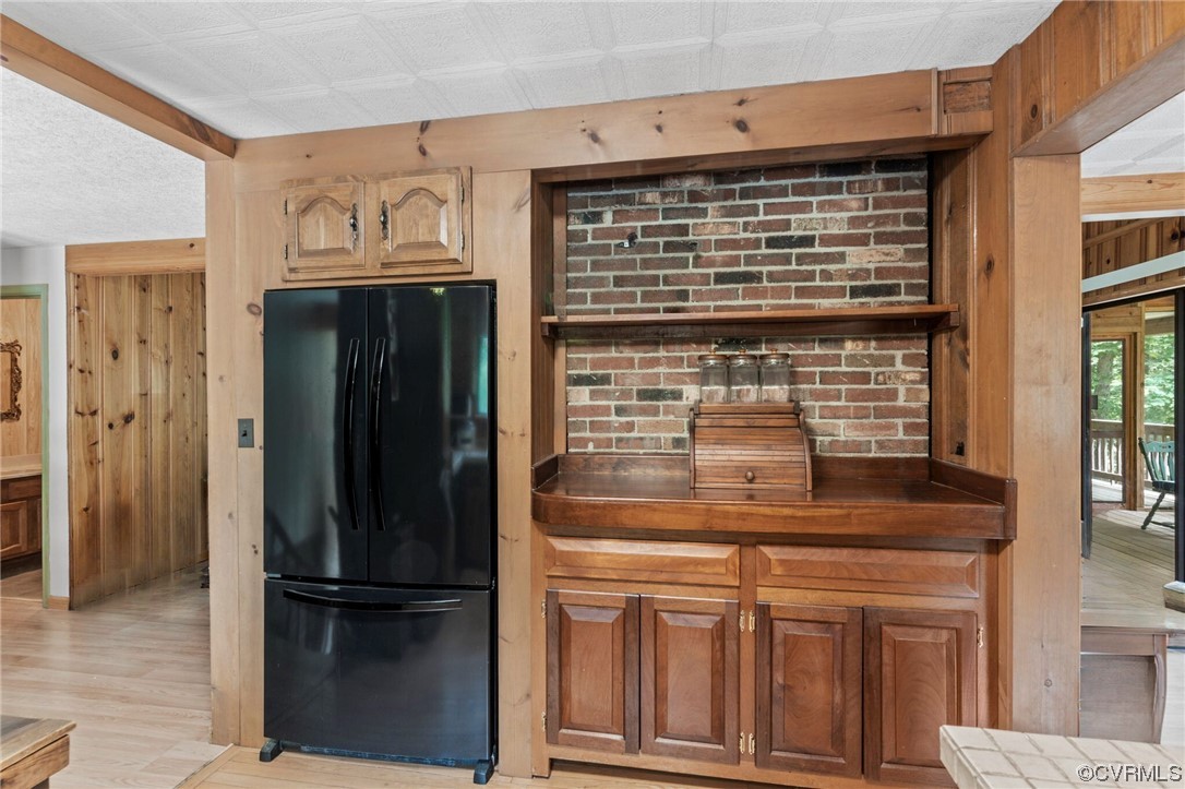 7192 South James River Road Buckingham, VA 23921 - Photo 13 of 29 a view of a refrigerator in kitchen and wooden floor