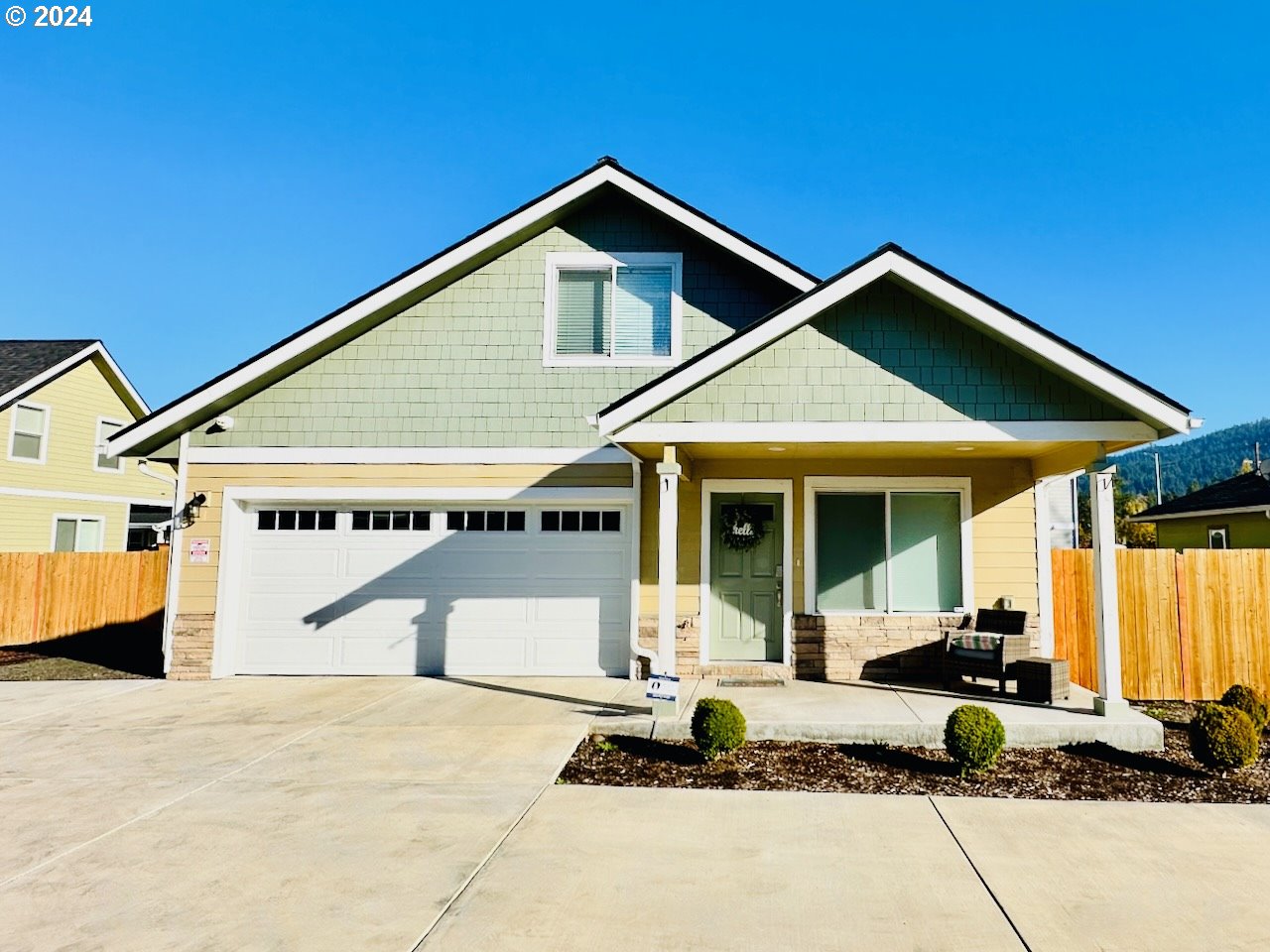 6470 Main Street Springfield, OR 97478 - Photo 1 of 35 a front view of a house with garage