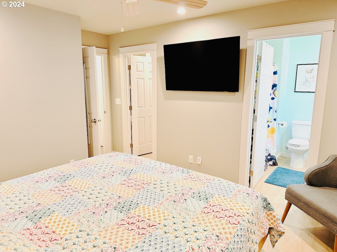 6470 Main Street Springfield, OR 97478 - Photo 14 of 35 a bedroom with a bed and a flat screen tv
