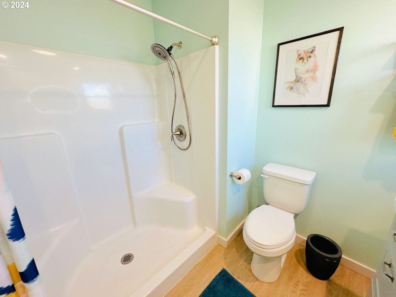 6470 Main Street Springfield, OR 97478 - Photo 17 of 35 a bathroom with a toilet and a shower