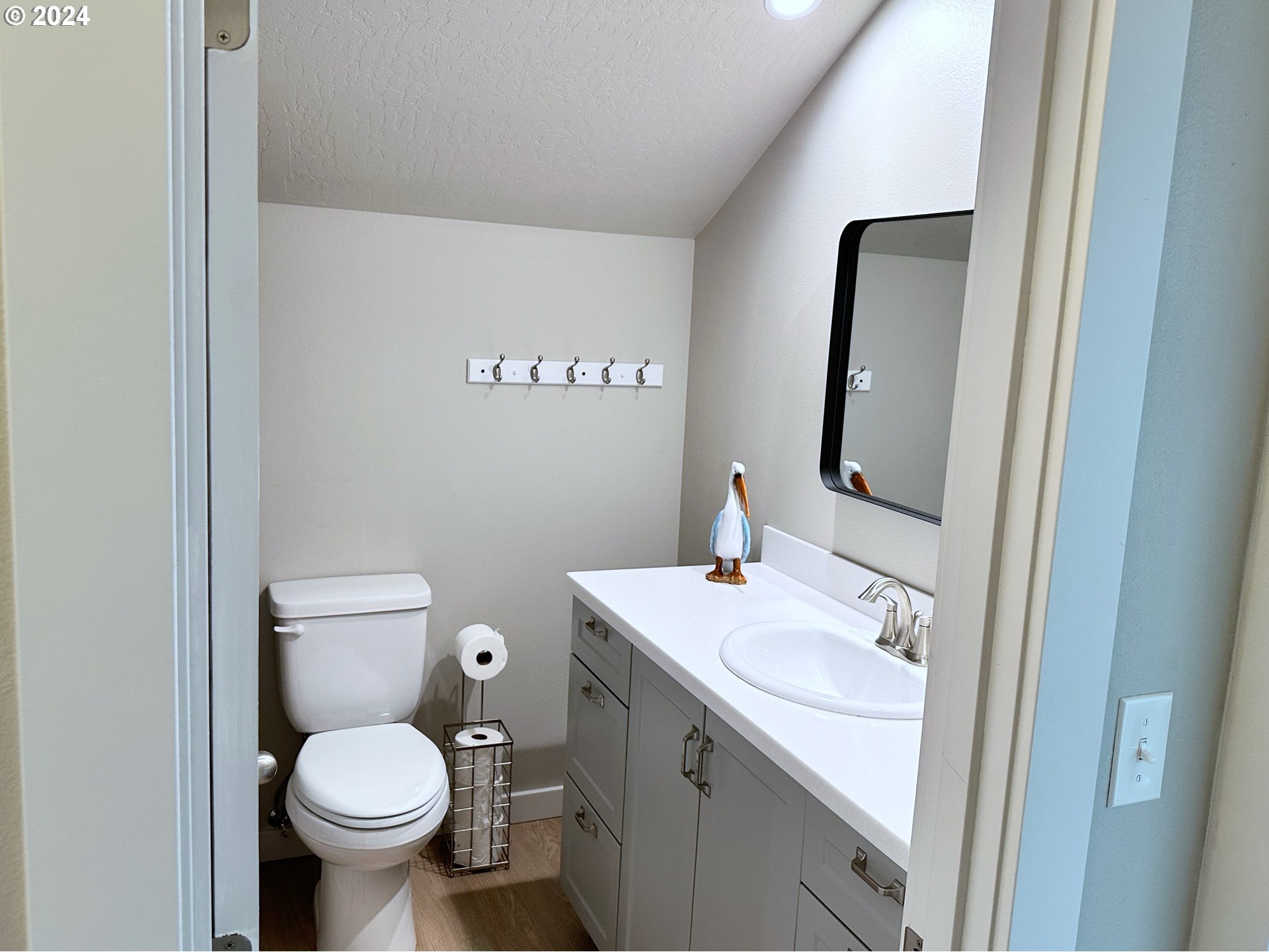 6470 Main Street Springfield, OR 97478 - Photo 23 of 35 a bathroom with a toilet sink and mirror