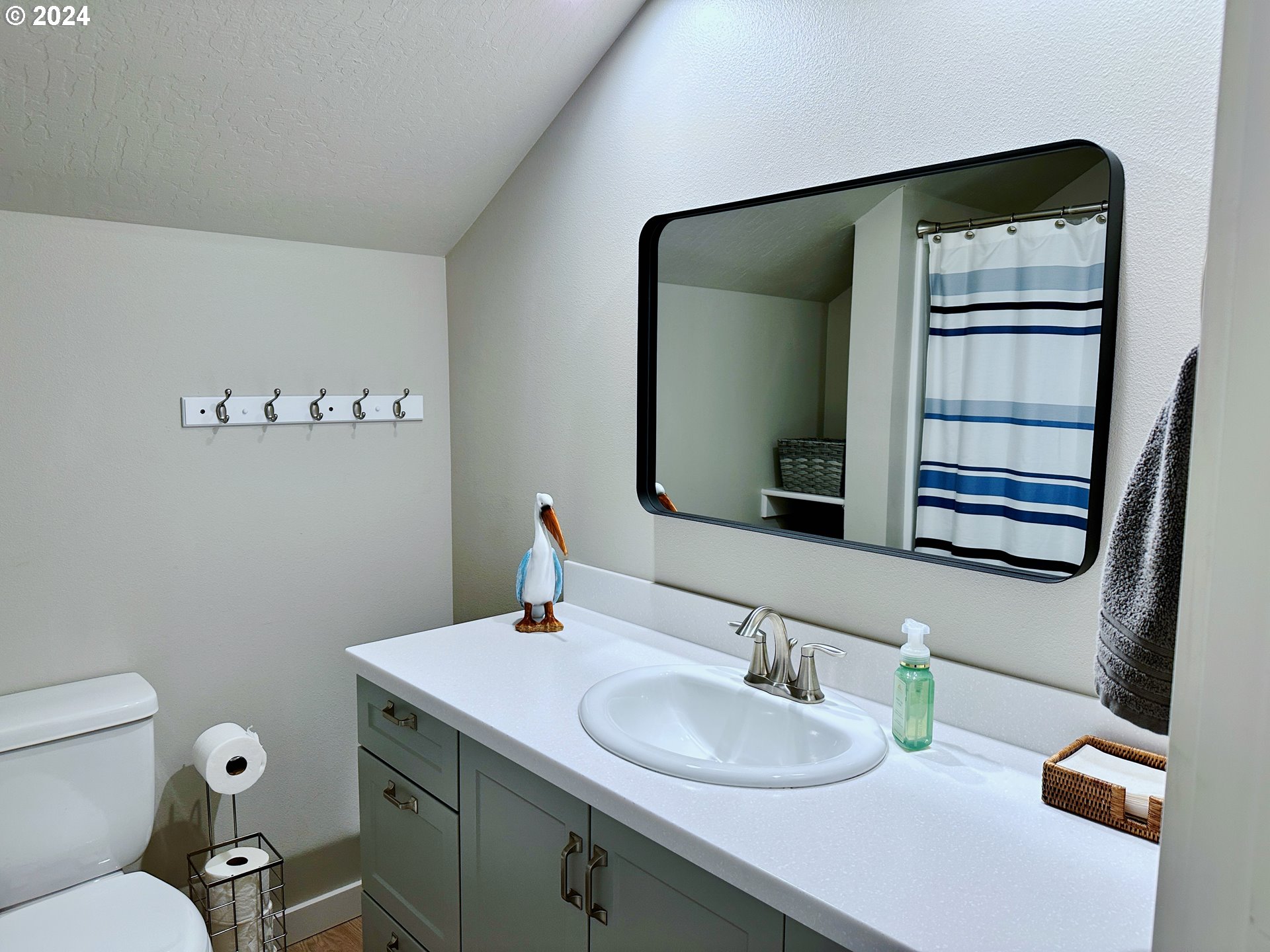6470 Main Street Springfield, OR 97478 - Photo 24 of 35 a bathroom with a granite countertop sink and a mirror