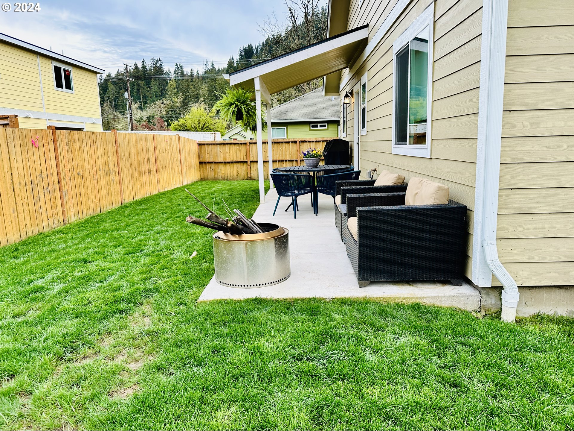 6470 Main Street Springfield, OR 97478 - Photo 34 of 35 a view of backyard of house with outdoor seating and green space