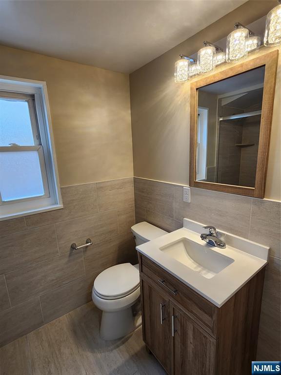 111 Church Street Lodi, NJ 07644 - Photo 14 of 21 a bathroom with a sink and a toilet