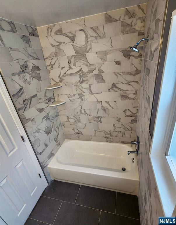 111 Church Street Lodi, NJ 07644 - Photo 17 of 21 a bathroom with a bathtub