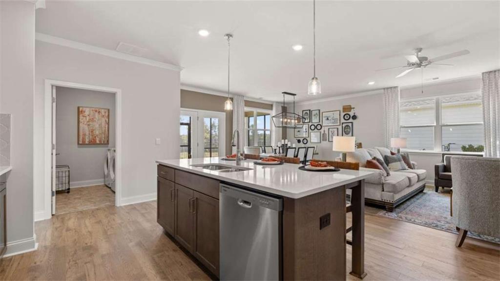 636 Parnassus Road Locust Grove, GA 30248 - Photo 17 of 44 a kitchen with counter space appliances and a ceiling fan