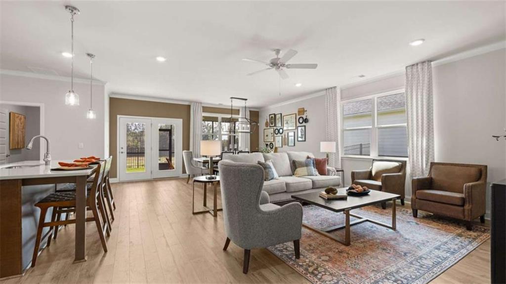 636 Parnassus Road Locust Grove, GA 30248 - Photo 33 of 44 a living room with furniture and a large window