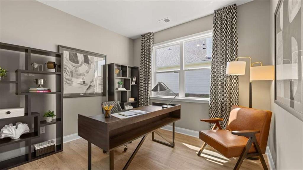 636 Parnassus Road Locust Grove, GA 30248 - Photo 36 of 44 a view of a workspace with furniture and a window