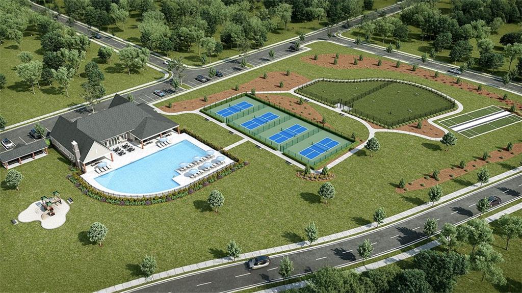 636 Parnassus Road Locust Grove, GA 30248 - Photo 4 of 44 an aerial view of a tennis ground and a cars park side of the road