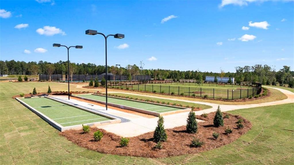 636 Parnassus Road Locust Grove, GA 30248 - Photo 5 of 44 a view of a swimming pool with a patio and a yard