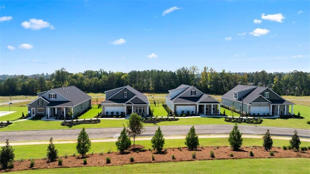 636 Parnassus Road Locust Grove, GA 30248 - Photo 10 of 44 a aerial view of a house with a big yard