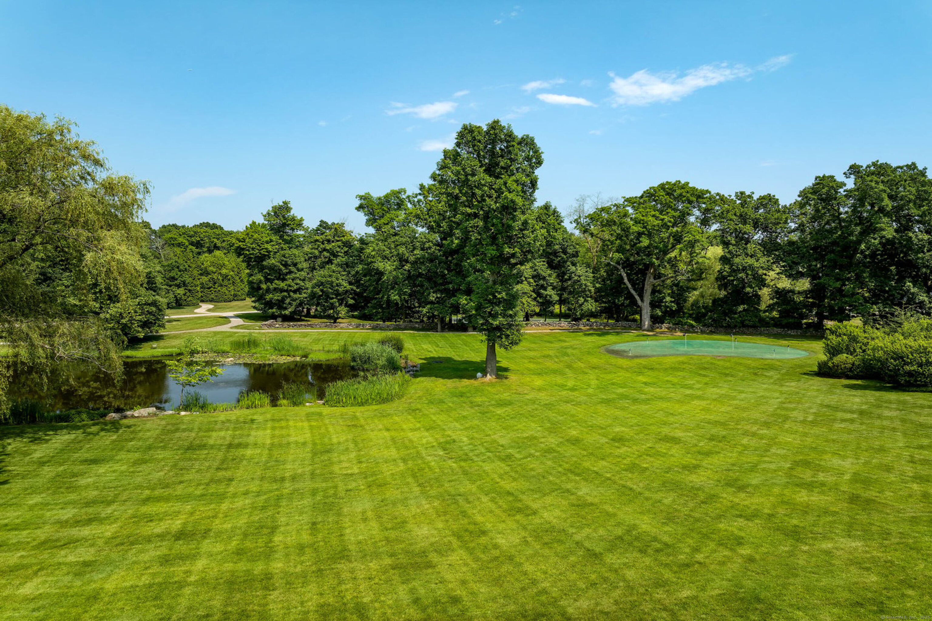 1619 Purchase Street Harrison, NY 10577 - Photo 34 of 37 a view of a golf course with a lake