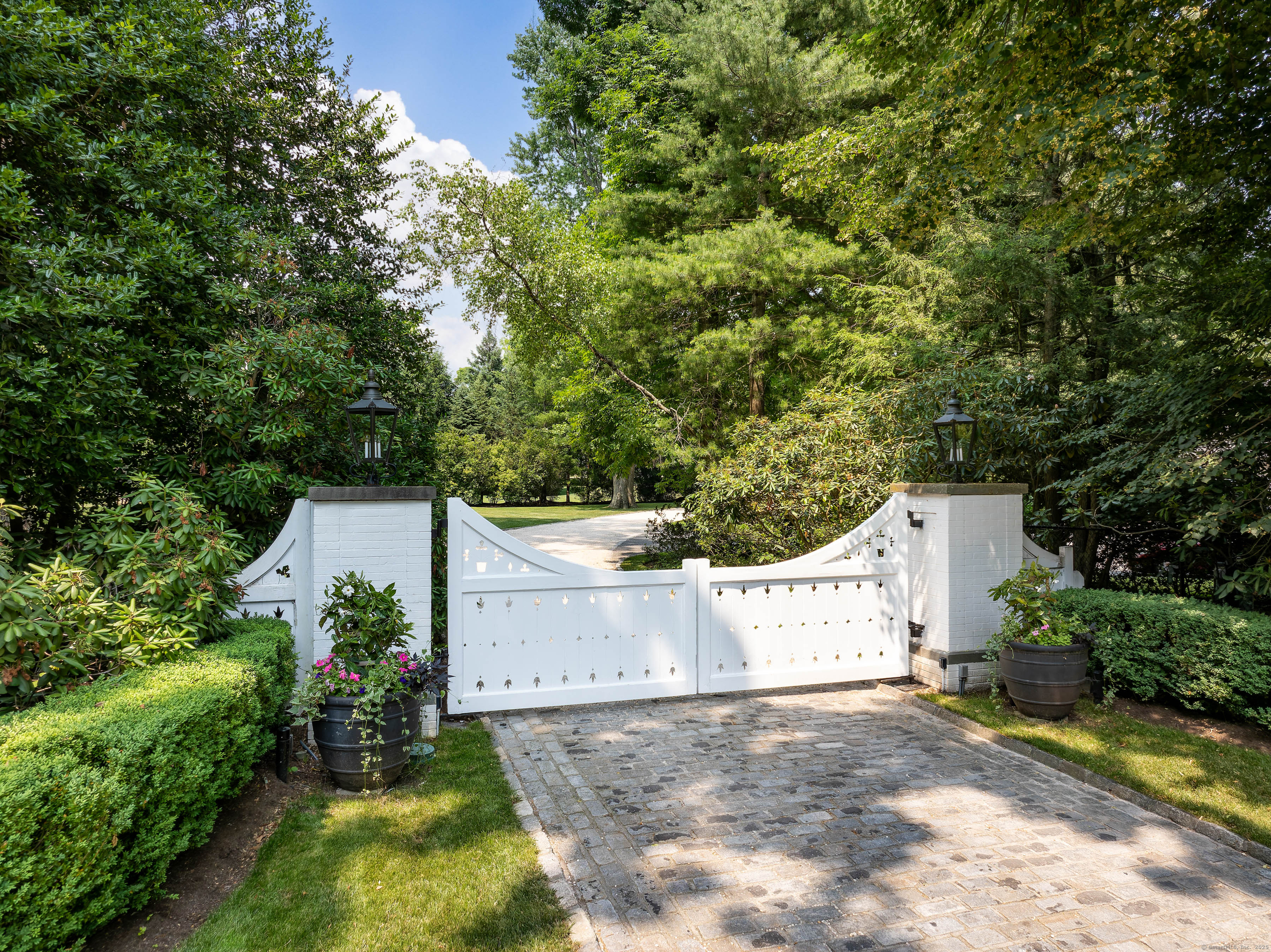 1619 Purchase Street Harrison, NY 10577 - Photo 5 of 37 an aerial view of a house with a yard and a garage