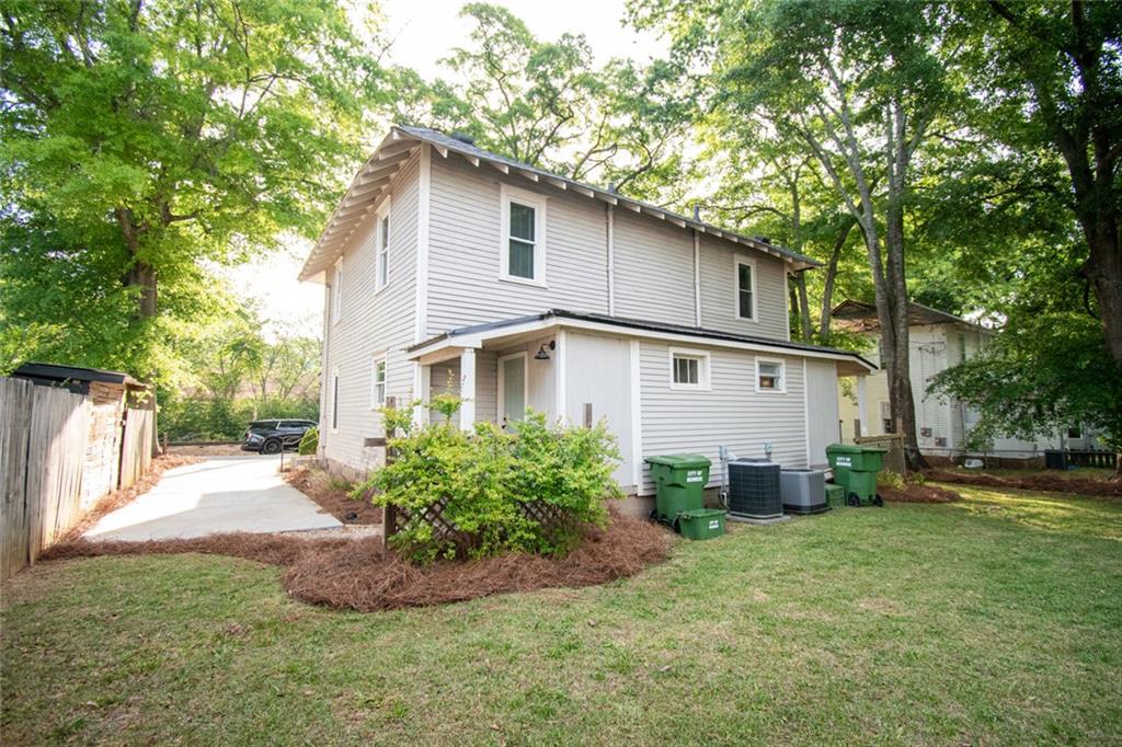 702 Radford Street Monroe, GA 30655 - Photo 45 of 49 a front view of house with yard and trees around