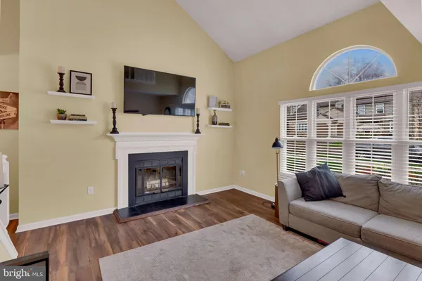 a view of room with window and wooden floor