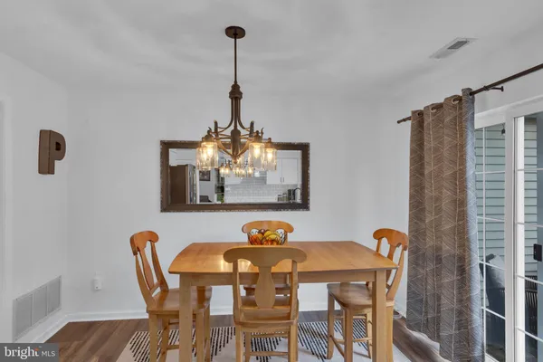 a view of a dining room and a table and chairs