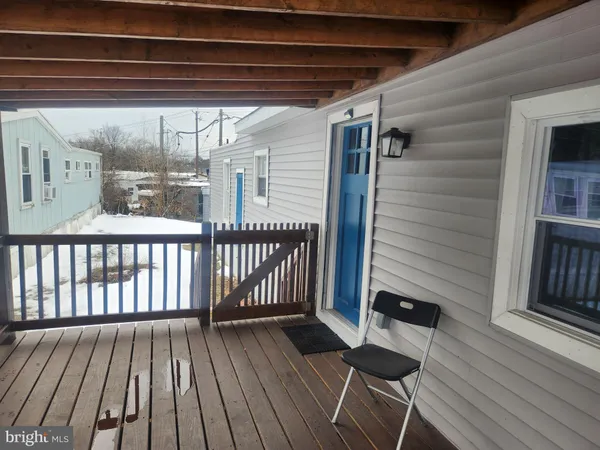 a view of deck with wooden floor and seating space