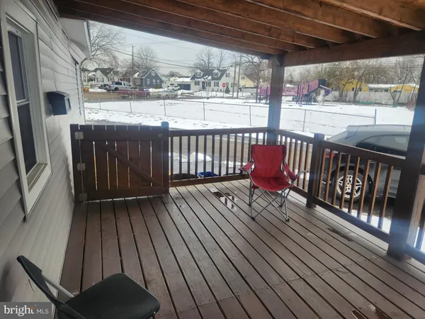 a view of balcony with wooden floor