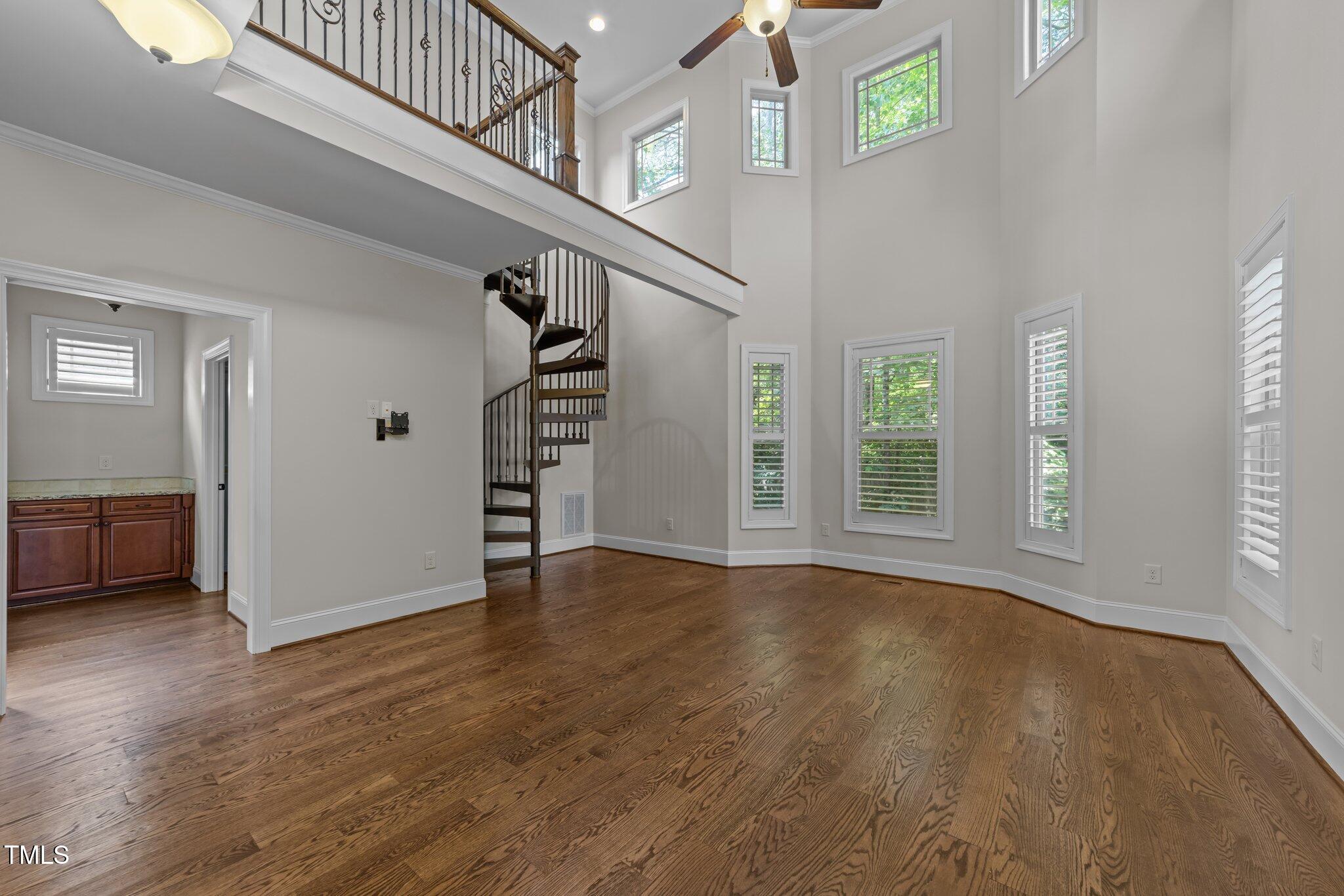 1512 Piazzo Court Apex, NC 27502 - Photo 15 of 59 a view of an empty room with window and stairs