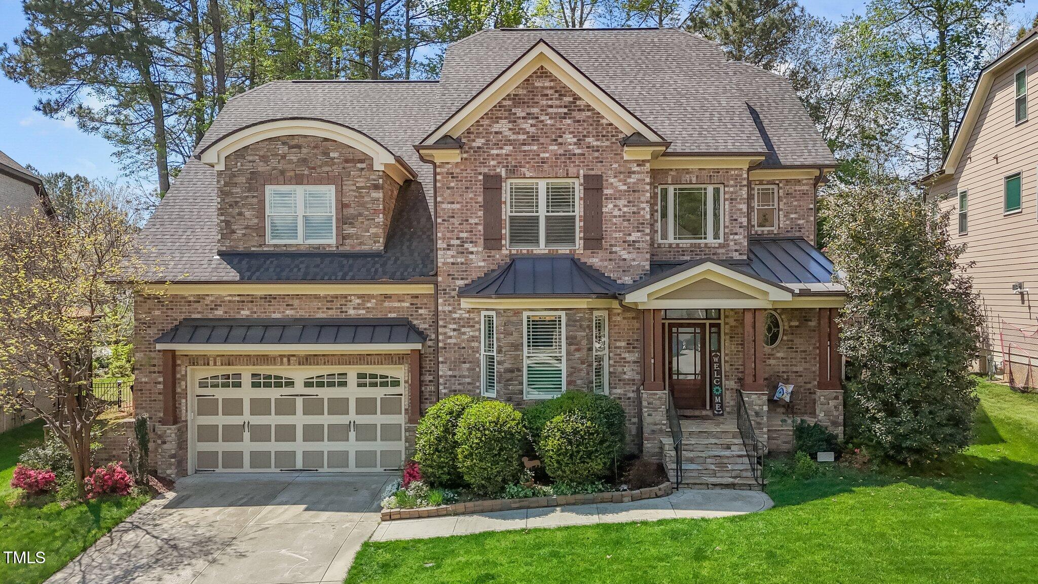1512 Piazzo Court Apex, NC 27502 - Photo 52 of 59 a front view of a house with garden
