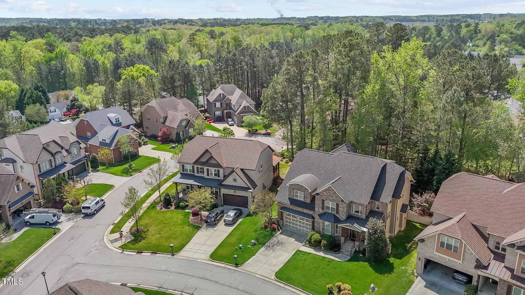 1512 Piazzo Court Apex, NC 27502 - Photo 55 of 59 an aerial view of a house with garden space and street view