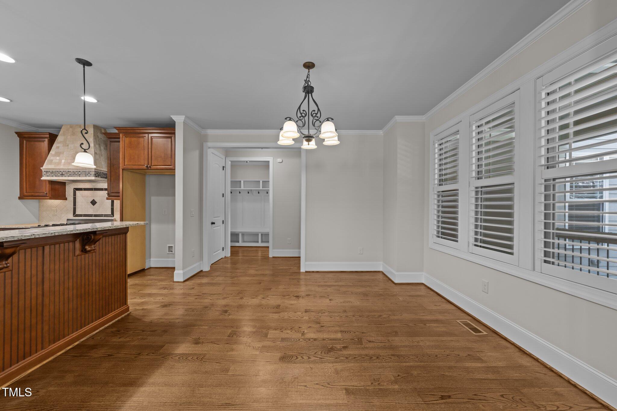 1512 Piazzo Court Apex, NC 27502 - Photo 8 of 59 a view of a kitchen with granite countertop a sink and dishwasher