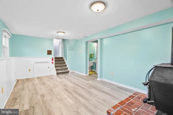 a view of room with stairs and a couch