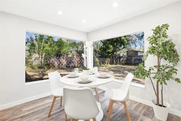 a view of a dining room with furniture window and outside view