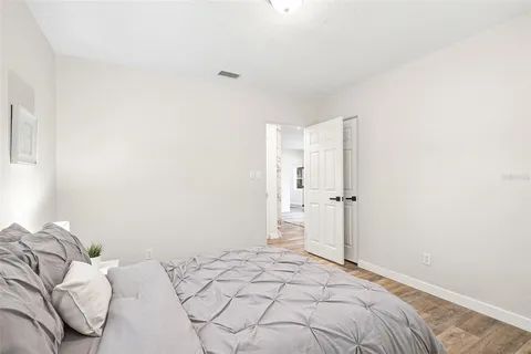 a bedroom with a bed and a shower