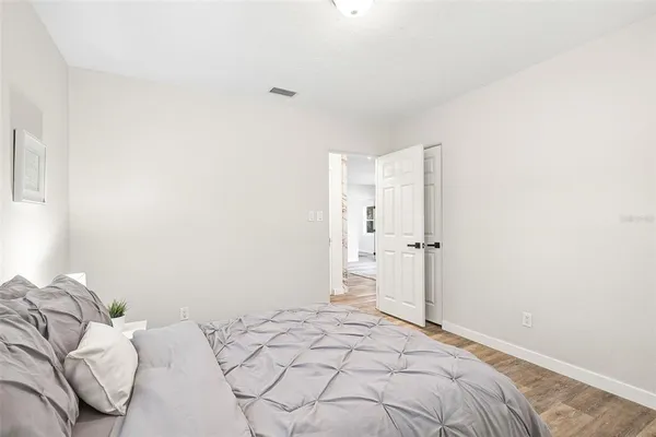 a bedroom with a bed and a shower