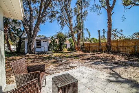 a view of a yard with trees