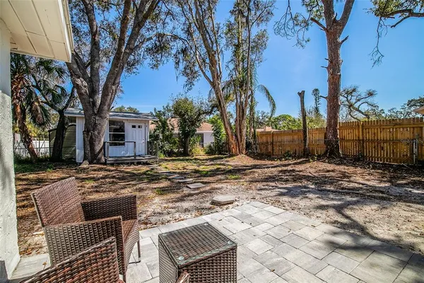 a view of a yard with trees