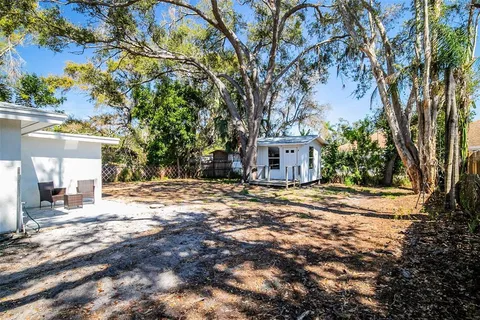a view of a house with a tree