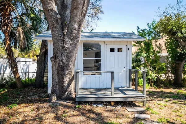 a front view of a house with trees