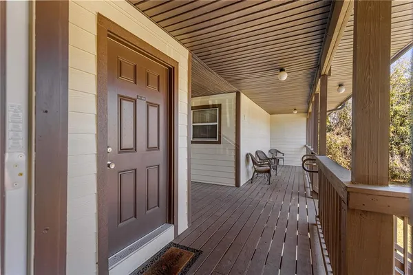 a porch with wooden floor