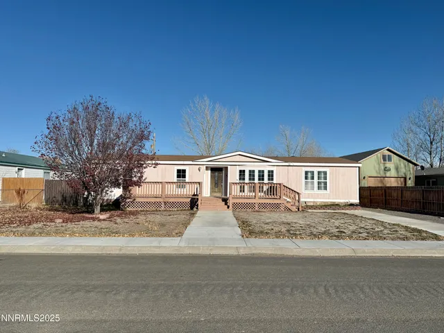 a front view of a house with yard