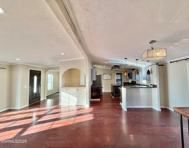 a kitchen with granite countertop a stove and a refrigerator
