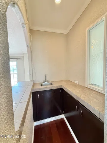 a kitchen with granite countertop stainless steel appliances and wooden cabinets