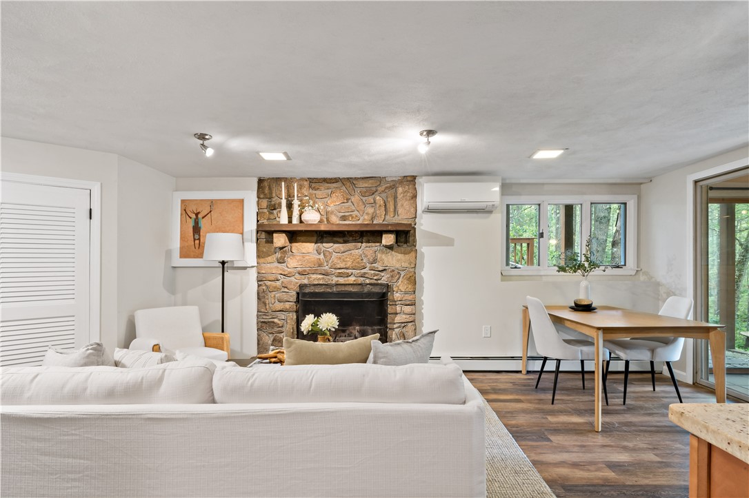 310 Old Coach Road Charlestown, RI 02813 - Photo 25 of 45 A stone front wood burning fireplace is the focal point of this living area as well.
