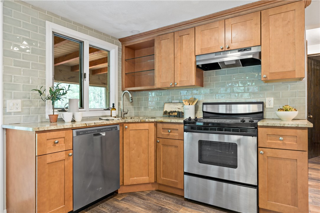 310 Old Coach Road Charlestown, RI 02813 - Photo 29 of 45 Ceramic tile, granite countertops and updated appliances round out the downstairs kitchen area.