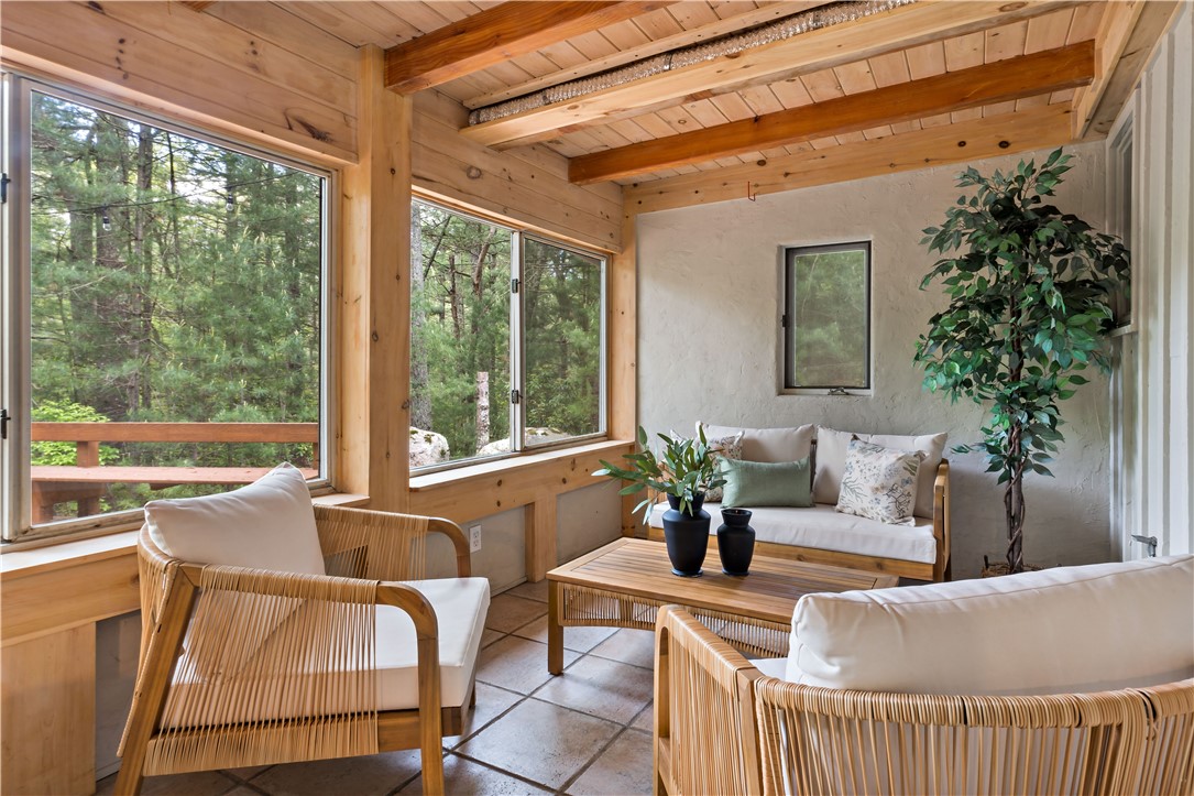 310 Old Coach Road Charlestown, RI 02813 - Photo 31 of 45 Sip your morning coffee in this Zen like sitting area in the downstairs screened in porch.
