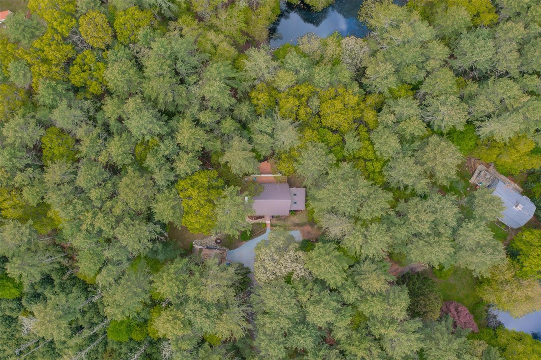 310 Old Coach Road Charlestown, RI 02813 - Photo 34 of 45 There is a pond at the rear of the almost 4 acre property.