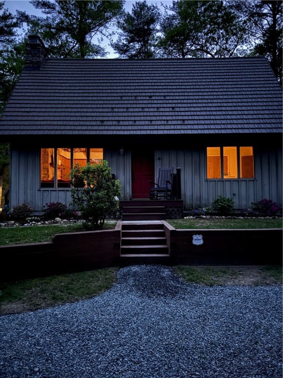 310 Old Coach Road Charlestown, RI 02813 - Photo 43 of 45 The soft glow of the indoor light light shining through at dusk.