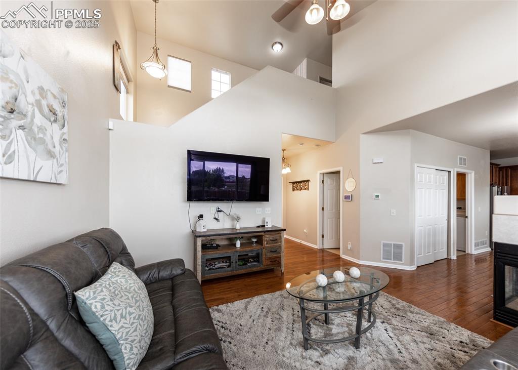 7751 Tompkins Road Peyton, CO 80831 - Photo 2 of 26 a living room with furniture and a flat screen tv