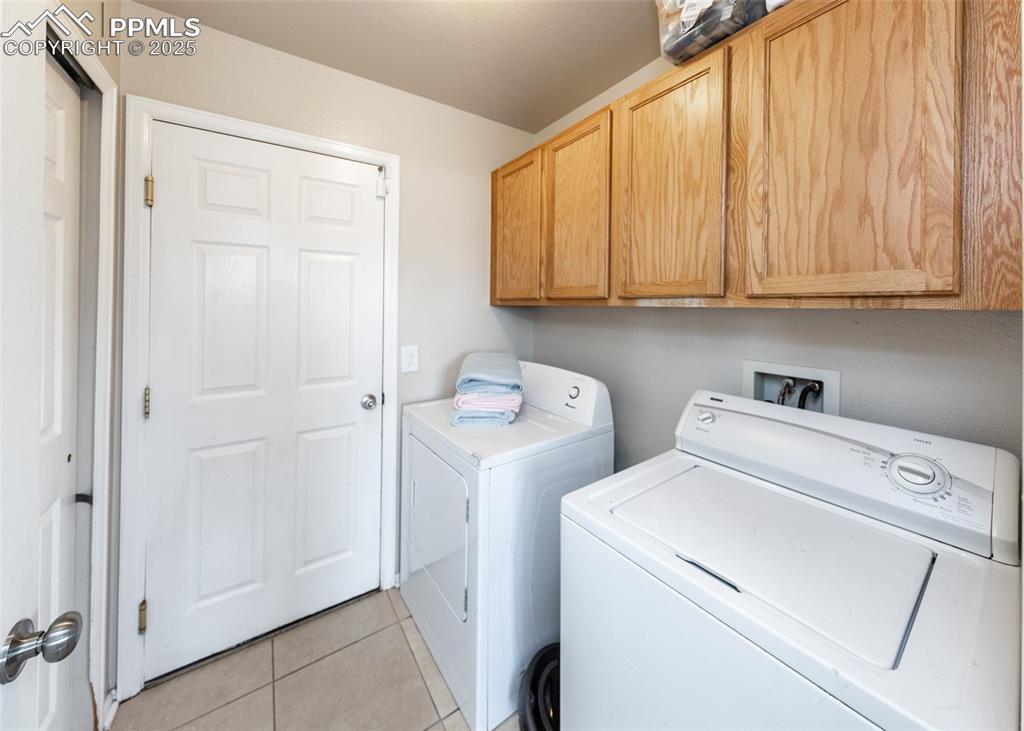 7751 Tompkins Road Peyton, CO 80831 - Photo 21 of 26 a view of storage and utility room with washer and dryer