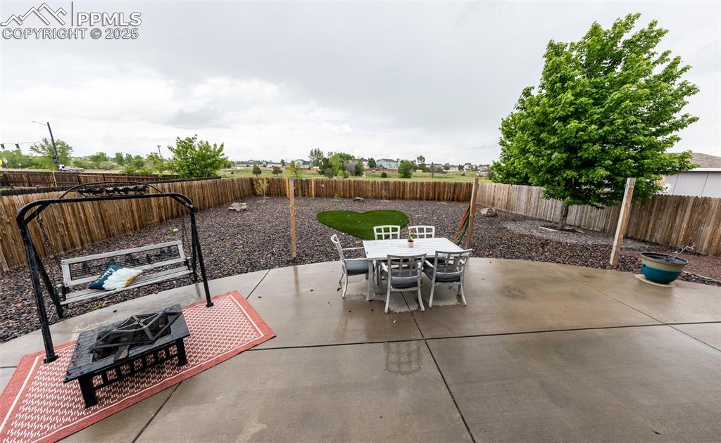 7751 Tompkins Road Peyton, CO 80831 - Photo 24 of 26 a view of a roof deck with furniture
