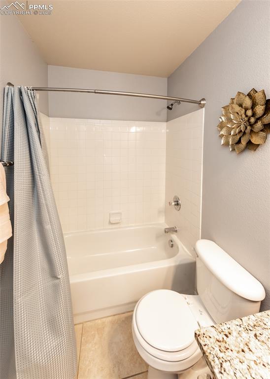 7751 Tompkins Road Peyton, CO 80831 - Photo 8 of 26 a white toilet sitting next to a bath tub and a shower